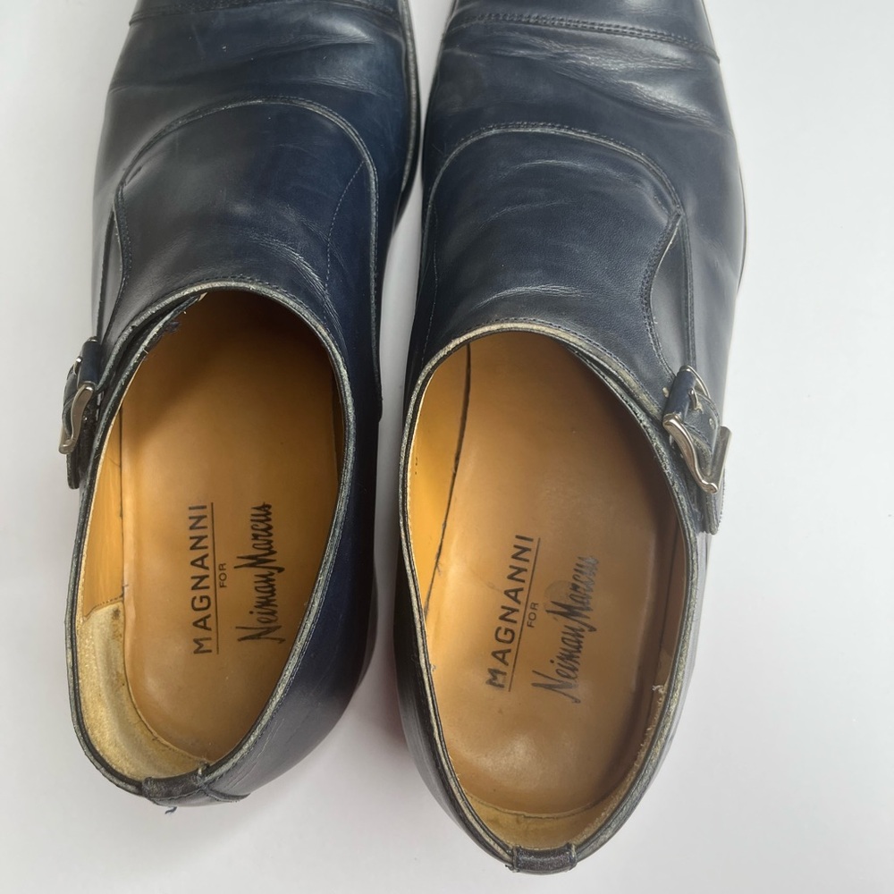 Navy blue leather dress shoe good condition minor scuffs no stains or odors.